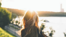 girl looking into the sun